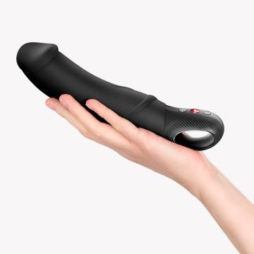 Fun Factory Big Boss Black Line Vibrator held in hand, showcasing its ergonomic design and luxury silicone material.