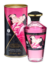 Shunga Aphrodisiac Warming Oil Raspberry Feeling 3.5 Oz bottle and packaging showcasing the erotic art design.
