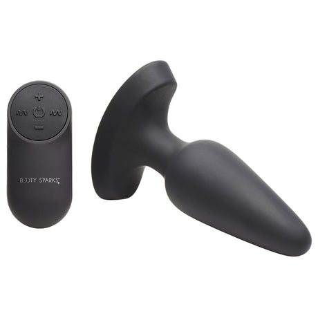 Booty Sparks 28x Laser Heart Silicone Anal Plug With Remote Medium displayed alongside its remote control.