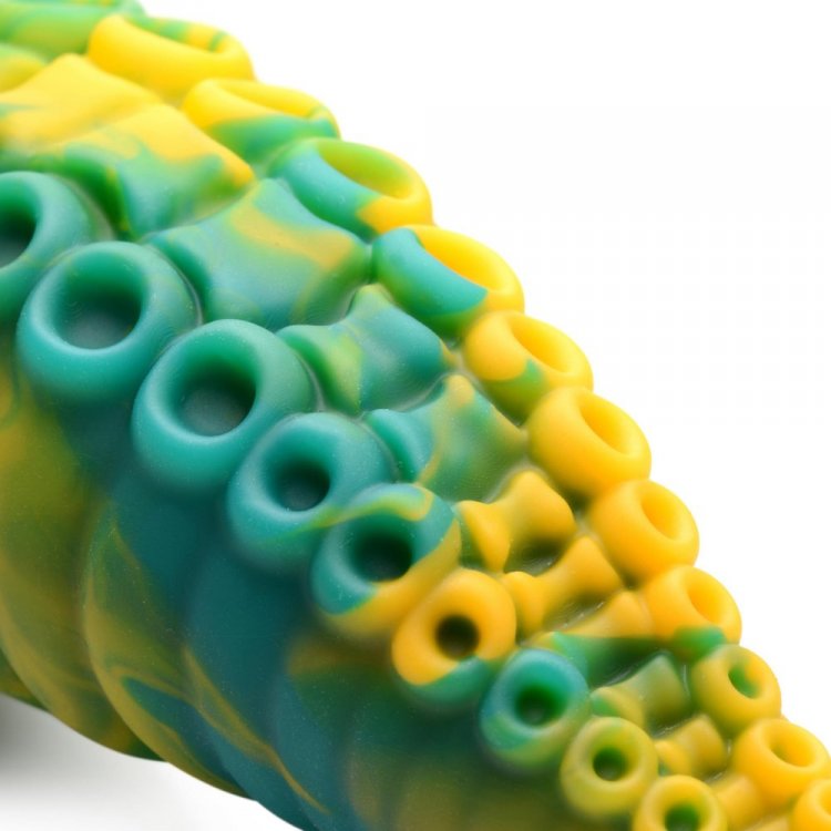 Close-up of the Creature Cocks Monstropus Tentacled Monster Dildo showcasing its unique green, yellow, and blue silicone pattern.