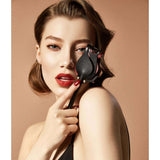 Woman holding ZALO Doll Designer Collection Rose Riding Crop, luxury BDSM accessory in Italian leather, enhancing intimate aesthetics.