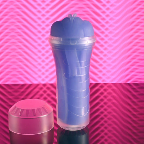 Zero Tolerance Pop On The Glow Pussy Stroker Purple showcased against a vibrant pink background.