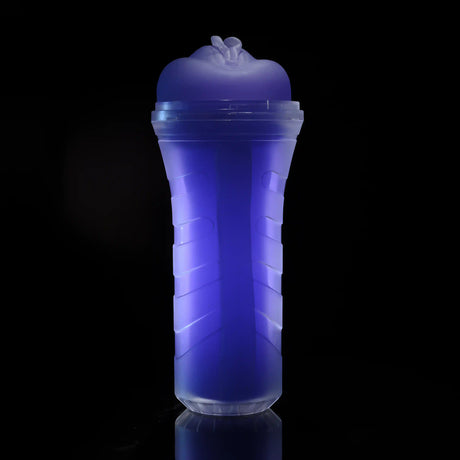 Zero Tolerance Pop On The Glow Pussy Stroker Purple displayed against a black background, showcasing its glow-in-the-dark feature.