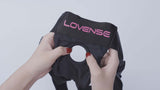 Lovense Strapless Harness for Lapis held by hands, showcasing its durable design and logo.