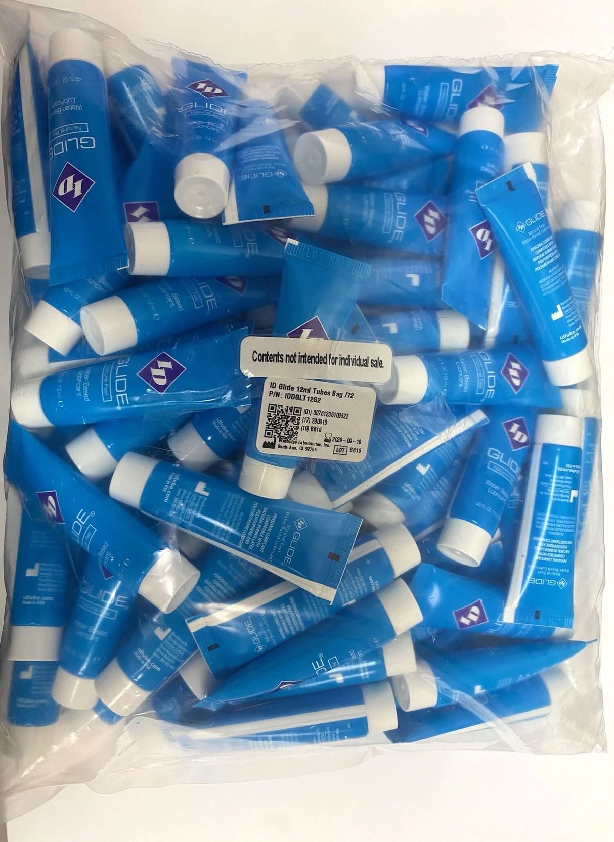 ID Glide Water-Based Lubricant 12 ml Tubes - Bag of 72 with blue packaging, ideal for personal and professional use.