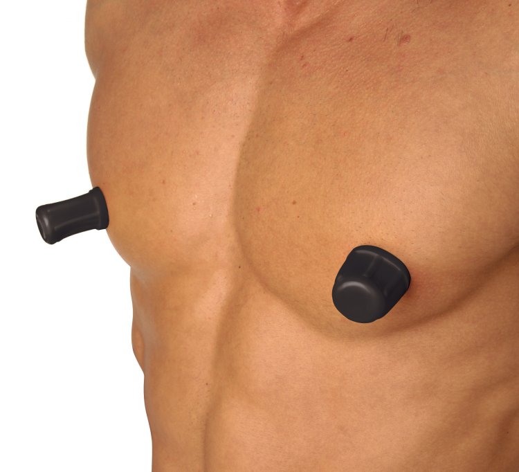 Master Series Viper Nipple Suckers Black on male chest for enhanced nipple play and stimulation.