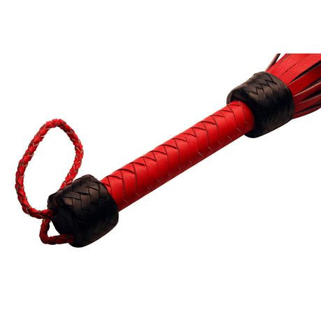 Strict Leather Heavy Tail Flogger Red and Black featuring a braided red and black handle.