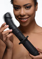 The Large Realistic 10X Silicone Vibrator with Handle being held by a smiling woman, highlighting its detailed design.