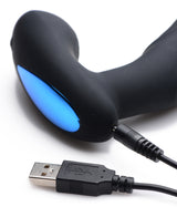 Alpha Pro 7X P-Thump Tapping Prostate Stimulator with charging cable and blue light indicator.
