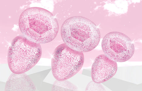 Booty Sparks Glitter Gem Anal Plug Set Pink featuring smooth, glittery pink plugs in graduated sizes.