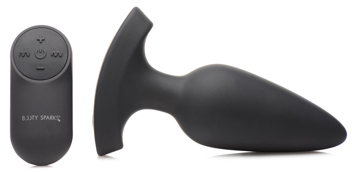 28X Laser Heart Silicone Anal Plug with Remote Large next to its remote control.