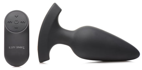 28X Laser Heart Silicone Anal Plug with Remote Large next to its remote control.