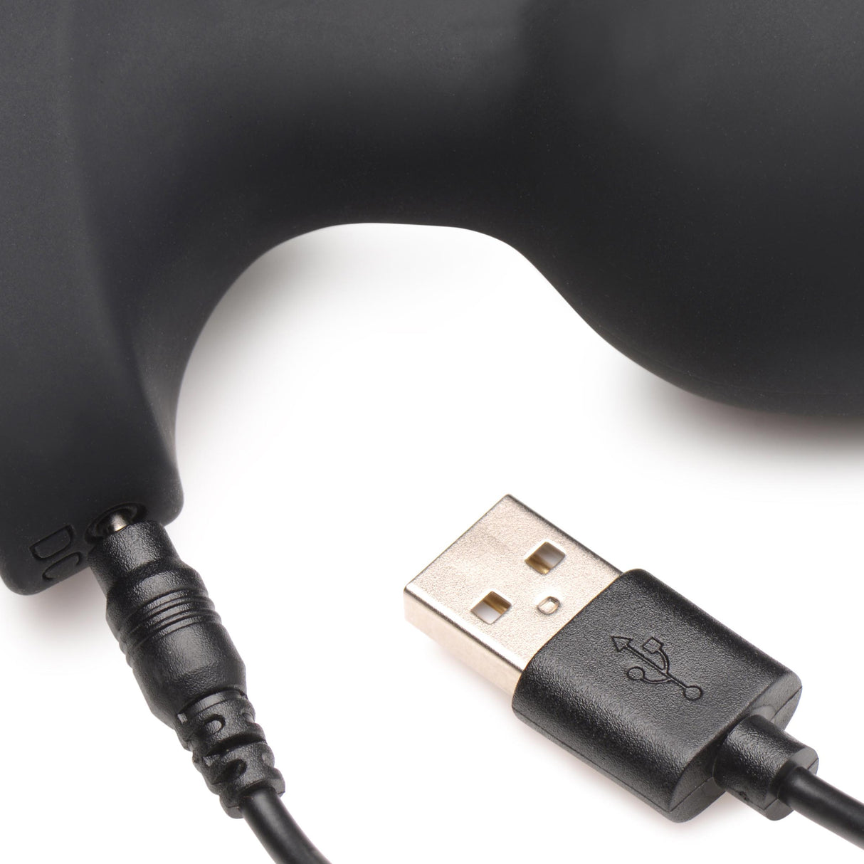 Close-up of the charging connector for the 28X Laser Heart Silicone Anal Plug with Remote Large.
