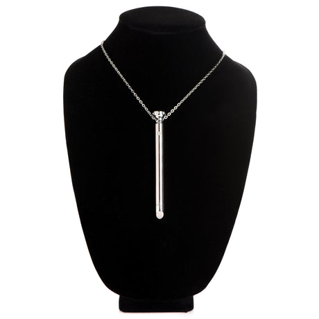 Charmed 7X Vibrating Necklace Silver displayed on a black necklace stand, showcasing its sleek design and features.