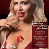 10X Vibrating Silicone Heart Necklace worn by a model, showcasing a red heart pendant on a shimmering chain.