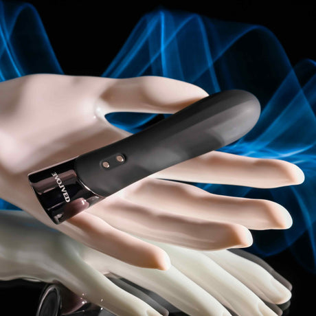 Evolved Back In Black Rechargeable Silicone Bullet in a hand for focused pleasure and sleek design.
