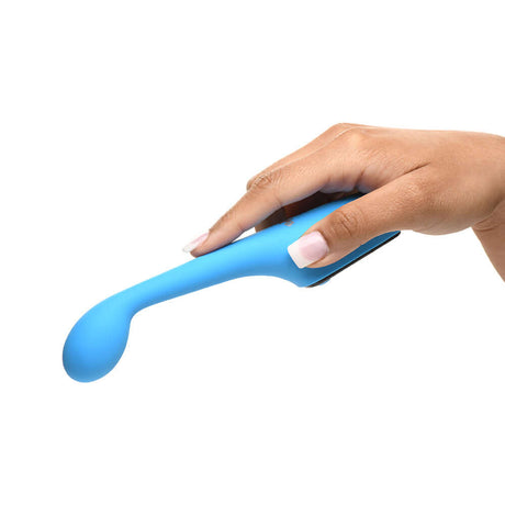 Close-up of a hand holding the BANG! Digital Silicone Vibrator in blue, showcasing its curved design and smooth texture.