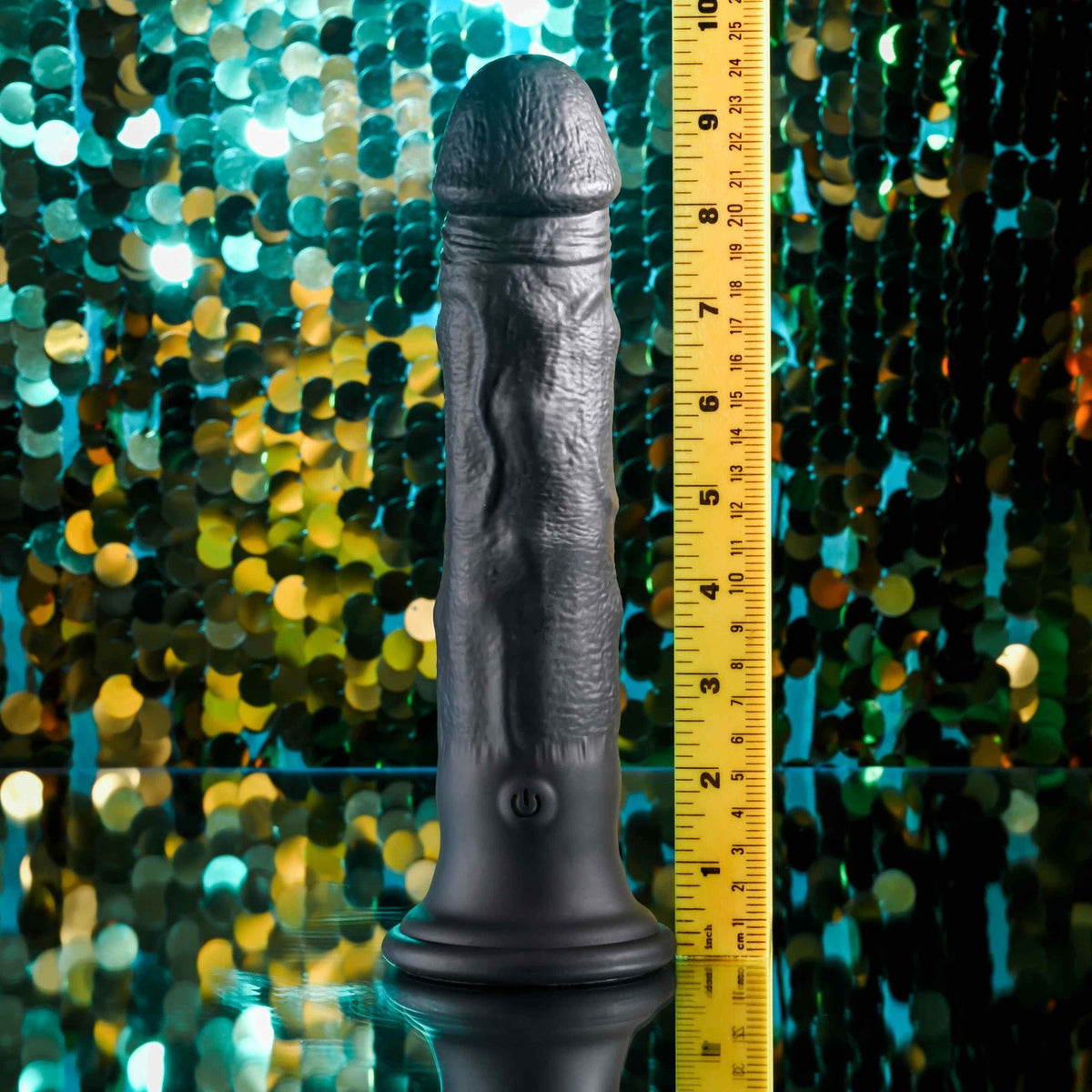 Evolved Black Thunder Vibrating Silicone Dildo Remote displayed with a measuring ruler for size reference.