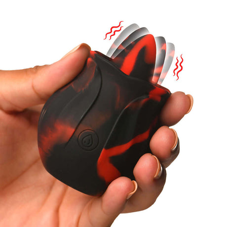Bloomgasm Black Kiss silicone rimming toy in hand, featuring a wagging tongue and vibrating function for enhanced pleasure.