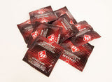 ID Studded Condoms 144 Count Bag displayed in a dynamic pile, showcasing vibrant foil packaging.