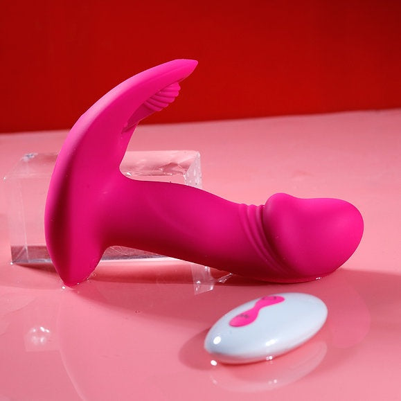 Litty Clitty Remote Control Wearable Vibrator on a pink surface with remote control for discreet pleasure.
