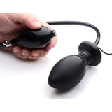 Vibro Inflatable Anal Plug Black held in hand with inflatable pump for adjustable anal pleasure.