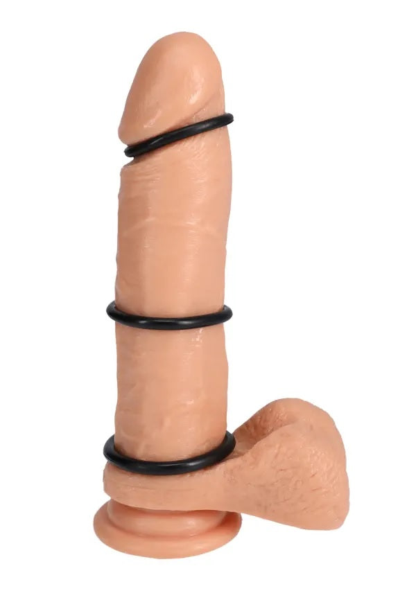 Rock Solid Tri-Pack Rubber Gasket Cock Ring Black with three graduated rings on a realistic figure.