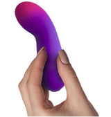 Rock Off Glo-Girl Vibe Pink Purple vibrator held in hand, showcasing its sleek design for G-spot stimulation.