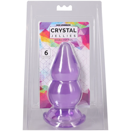 Crystal Jellies Double Pop Plug 6 Inch Purple in packaging, showcasing its double curve design for pleasurable sensations.
