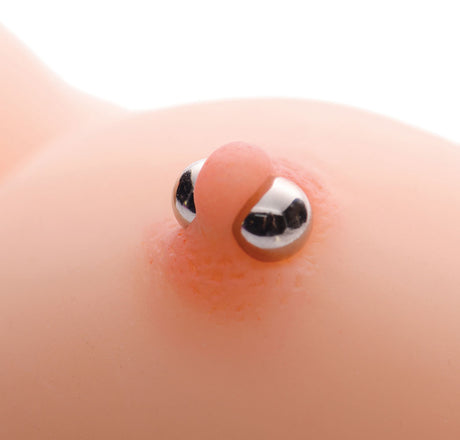 Close-up of Magnus XL Ultra Powerful Magnetic Nipple Orbs on skin, showcasing their intense pressure play capabilities.