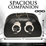 Master Series Cuffed & Loaded Travel Bag with handcuff handles, stylish bondage design, vegan faux leather, spacious and durable.