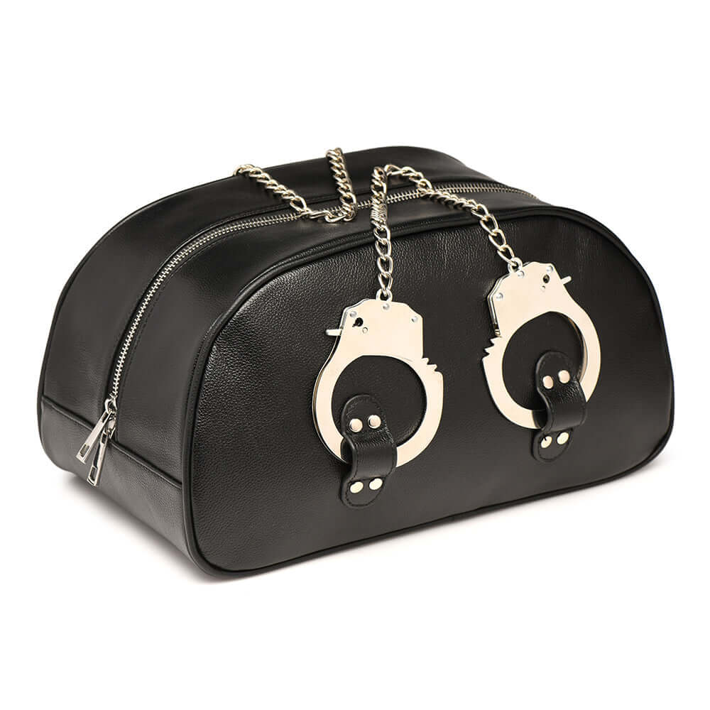 Master Series Cuffed & Loaded Travel Bag with handcuff handles, faux leather, perfect for overnight stays.