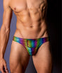 Male Power Pack & Play Rainbow Thong S/M displayed on a male model, featuring vibrant rainbow colors and a secure pouch pocket.