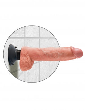 King Cock 10 Inch Vibrating Dildo with Balls Beige mounted on a suction cup for hands-free use.