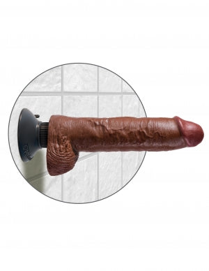 King Cock 10 Inch Vibrating Dildo with Balls Brown mounted on a bathroom wall, showing realistic detail and design.
