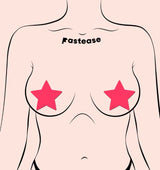 Pastease Star Glow In The Dark Pasties Neon Pink on a model's chest highlighting vibrant star-shaped nipple covers.