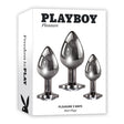 Playboy Pleasure 3 Ways Metal Anal Training Kit Black featuring three graduated butt plugs in stylish packaging.