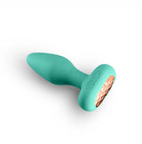 Techno Prism Silicone App Compatible Anal Plug Teal in teal silicone with an ergonomic design and textured base.