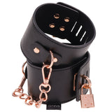 Sex and Mischief Brat Locking Cuffs Rose Gold Black with black vegan leather and rose gold accents.