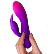 Rocks Off Glo-girl Rabbit Vibrator Pink Purple held in hand, showcasing its vibrant design and dual stimulation features.