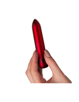 Poppy Red Rechargeable Bullet Vibrator held in hand, showcasing its sleek design and powerful performance.