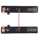 Sex and Mischief Brat Locking Cuffs Rose Gold Black featuring sleek black vegan leather and captivating rose gold accents.