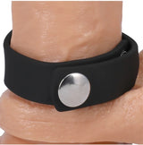 Rock Solid Silicone 3 Snap Adjustable Cock Ring Black on skin, showcasing adjustable snap closure and body-safe silicone.