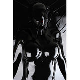 Extreme Black Latex Vacuum Bed showcases a body encased in sleek black latex for total immobilization.