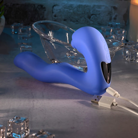 Evolved Tappity Tap Silicone Vibrator Blue on a marble surface with USB charging cable.