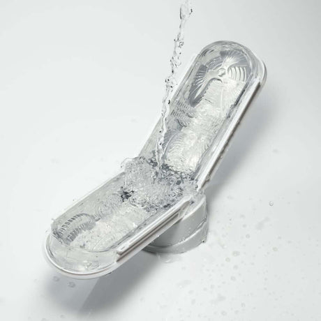 Tenga Flip Zero Gravity White Male Stroker with water splash effect, showcasing its sleek design and premium features.