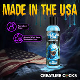 Creature Cum Blue Jizz Water-Based Lubricant 8 Oz bottle on a background with American flag, paraben free.