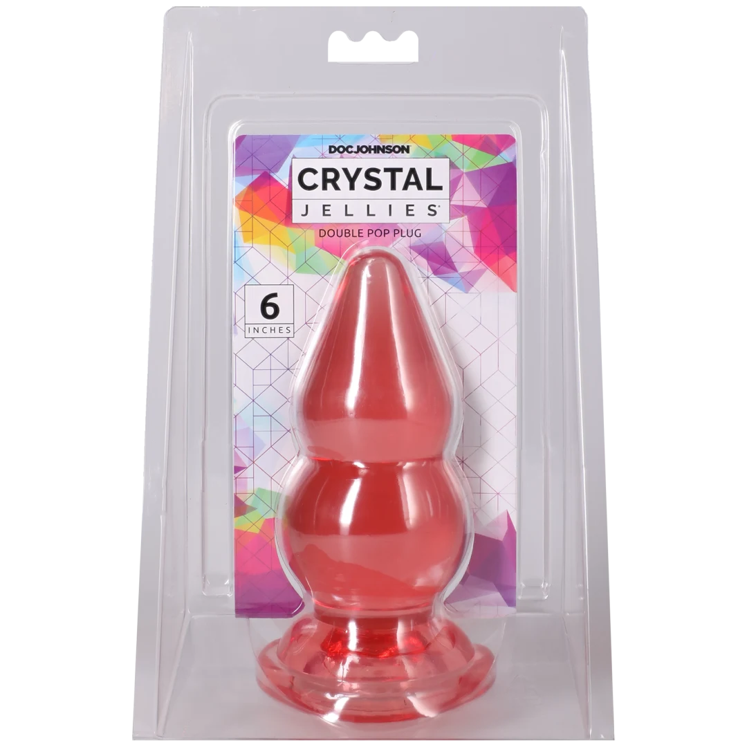 Crystal Jellies Double Pop Plug 6 Inch Pink in packaging showcasing its double curve design.