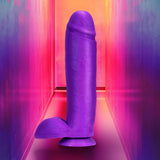 Neo Elite 10 Inch Silicone Dual Density Cock with Balls Purple displayed in a vibrant colorful background.
